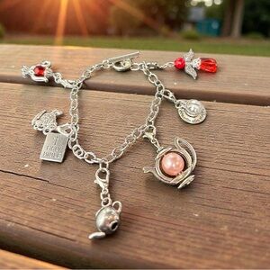 Silver Religious Charm Bracelet with Red and Pink Accents